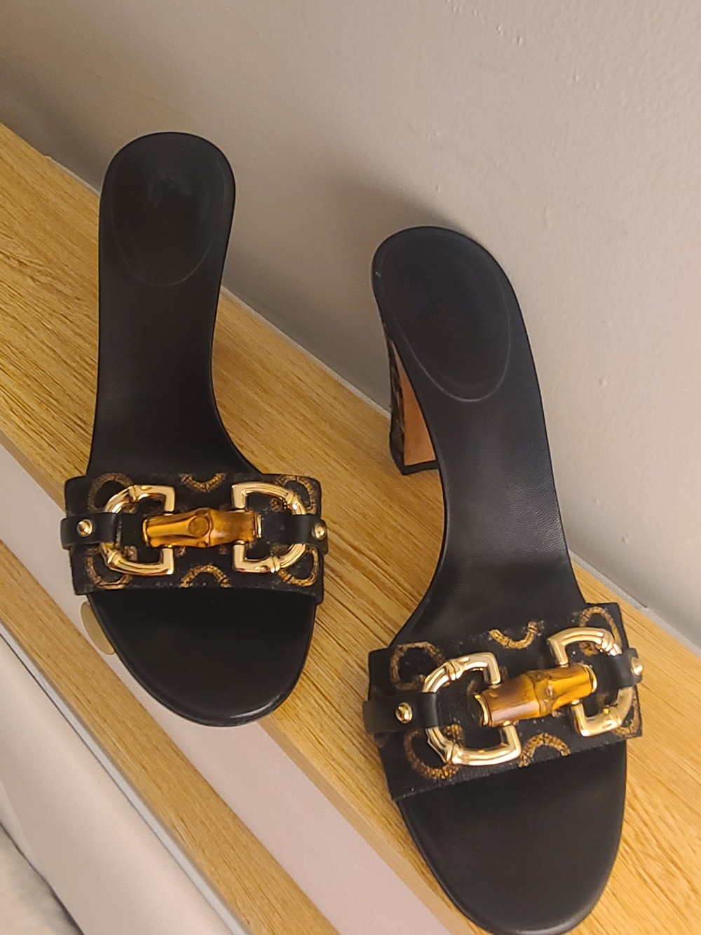 Gucci Black Leather Slide Mules with Gold Chain and Brown Bamboo Accent